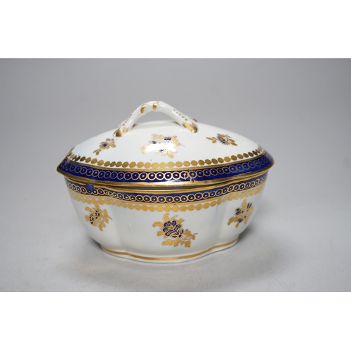 341 - An 18th century Caughley tureen cover and stand with blue and gilt decoration, stand mis-fired to bo... 