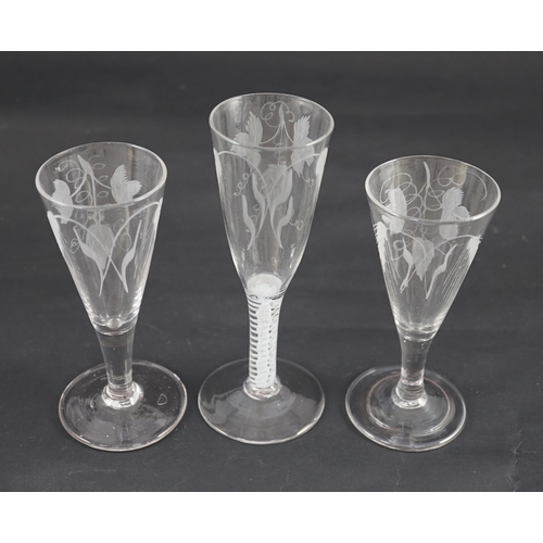 359 - Three hops and barley wheel engraved glass ale flutes, mid 18th century, the tallest with double s... 