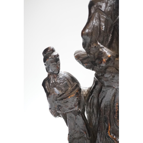 369 - A Chinese root wood carving of two women, 42cm