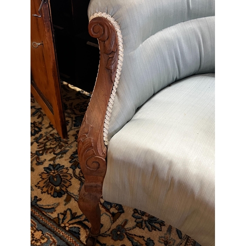 37 - An Edwardian upholstered tub framed settee, length 148cm, depth 68cm, height 70cm