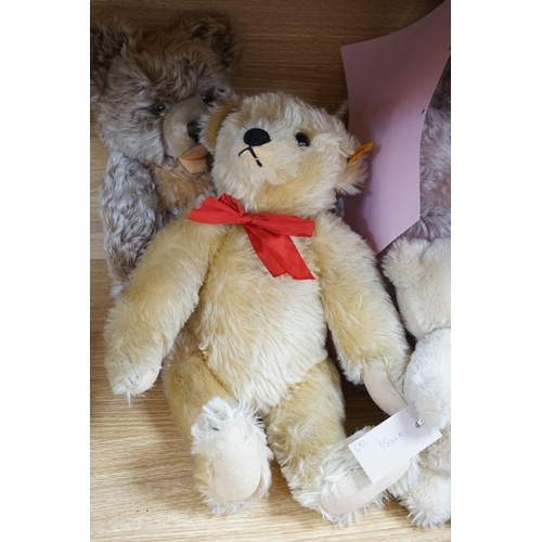 374 - A large Steiff growler blonde plush teddy bear, 68cms long and four other Steiff teddy bears,