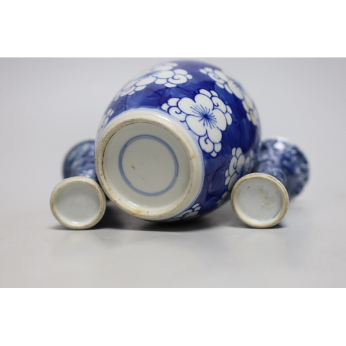 390 - A Chinese blue and white prunus jar, two miniature vases and a dish, all Kangxi period, jar 14cms hi... 