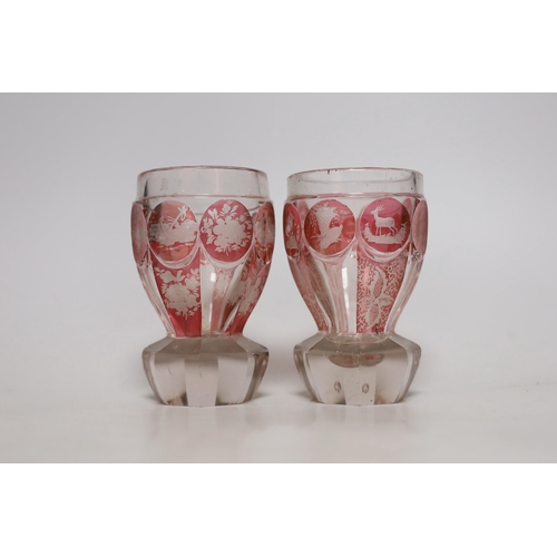 393 - A pair of late 19th century Bohemian wheel engraved ruby stained glass beakers, 13.5cms high