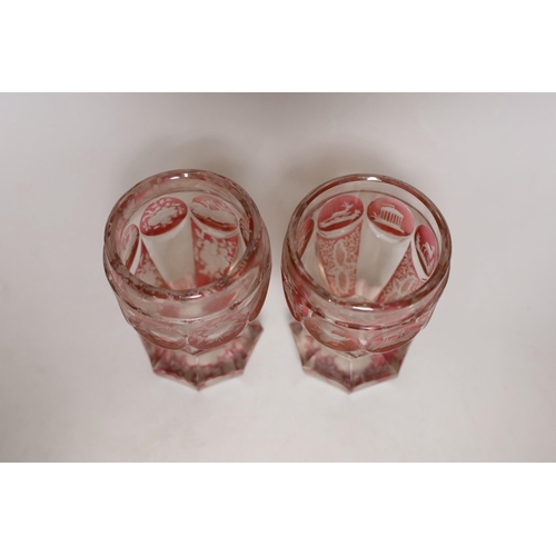 393 - A pair of late 19th century Bohemian wheel engraved ruby stained glass beakers, 13.5cms high