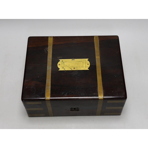 415 - A Victorian rosewood brass bound toilet box, with contents, 21cms deep x 27cms wide