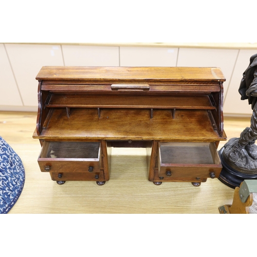 419 - An early 20th century miniature beech tambour pedestal desk, possibly an apprentice piece, 67cms wid... 