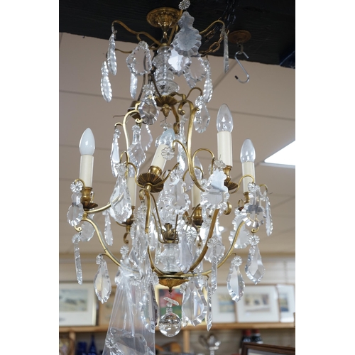 432 - A late 19th/early 20th century French ormolu and lustre hung chandelier, drop approximately 70cm... 