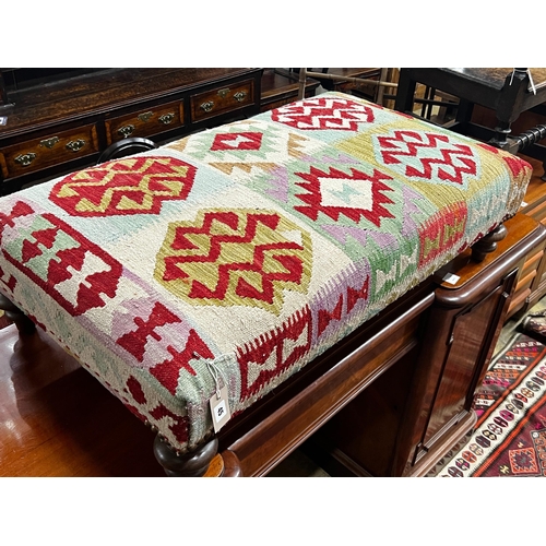 45 - A large contemporary rectangular polychrome Kilim footstool on turned feet, length 108cm, depth 64cm... 