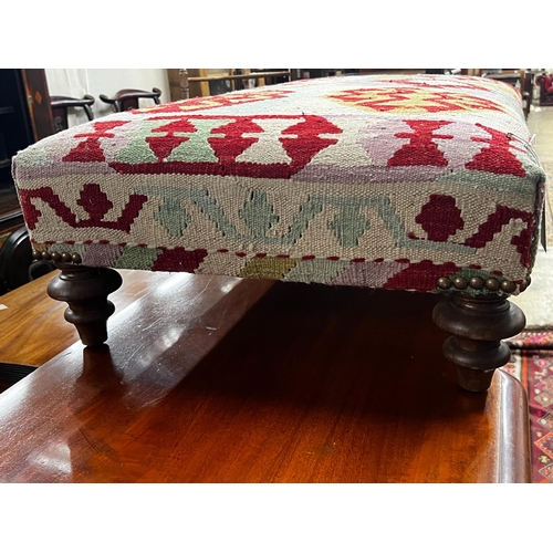 45 - A large contemporary rectangular polychrome Kilim footstool on turned feet, length 108cm, depth 64cm... 