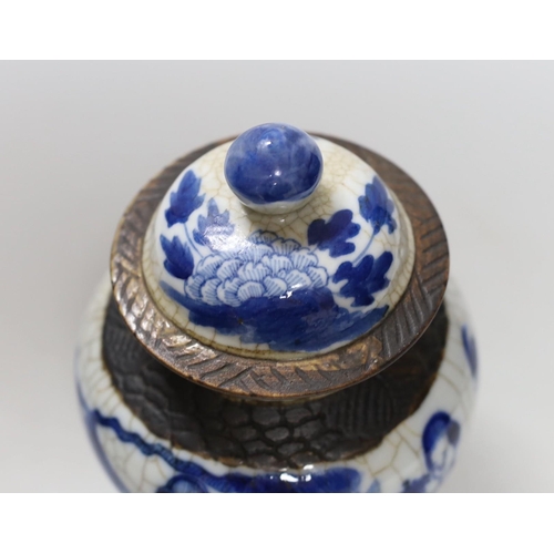 453 - A 19th century Chinese blue and white crackle glaze vase and cover, 20cm