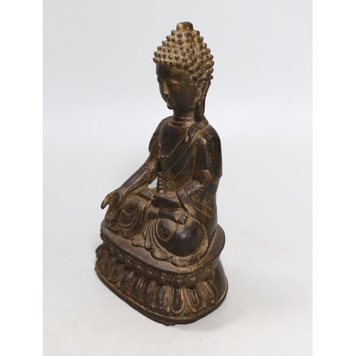 454 - A Chinese gilt iron seated figure of Buddha, 19cm