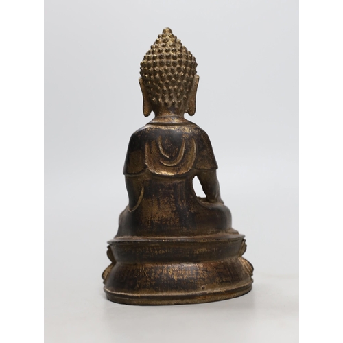 454 - A Chinese gilt iron seated figure of Buddha, 19cm