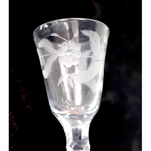 464 - A George III facet stem wine or cordial glass, wheel engraved flowers. 16.5cm tall