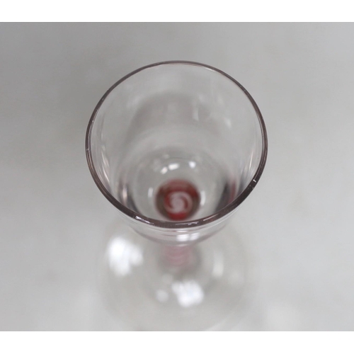 466 - A Dutch red and white colour twist stem wine glass. 15cm tall