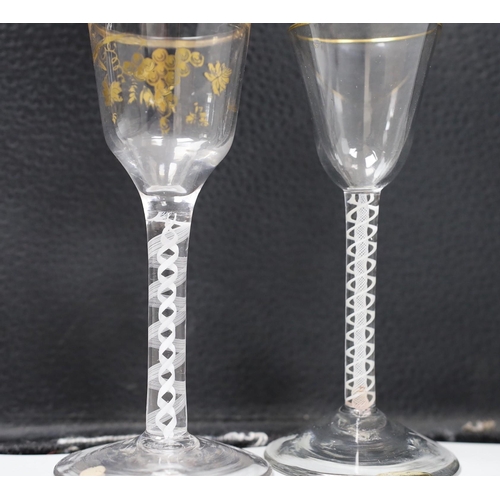 471 - Two George III DSOT stem James Giles gilt decorated wine glasses. Tallest 15cm