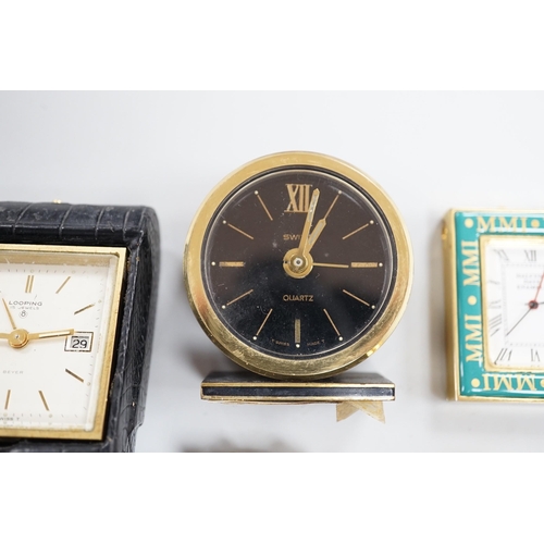 485 - A Halcyon Days Harrods paperweight, a Halcyon Days timepiece and three other timepieces