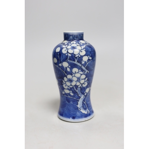 487 - A small 19th century Chinese blue and white prunus vase. 13.5cm tall