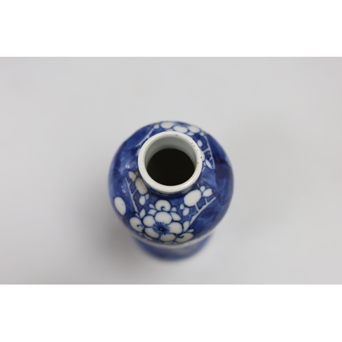 487 - A small 19th century Chinese blue and white prunus vase. 13.5cm tall