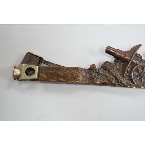 504 - An early 20th century Austrian bronze cigar cutter cast with an artillery cannon 19.5cm long