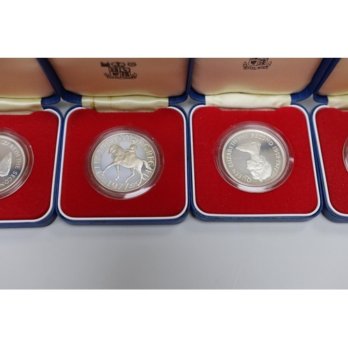 518 - Royal Mint proof silver coins - three QEII UK Silver Jubilee crowns and four Commonwealth crowns (7)... 