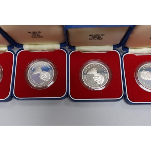 521 - Eight Royal Mint Commonwealth commemorative proof silver crowns