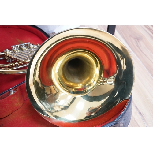 527 - A cased French horn