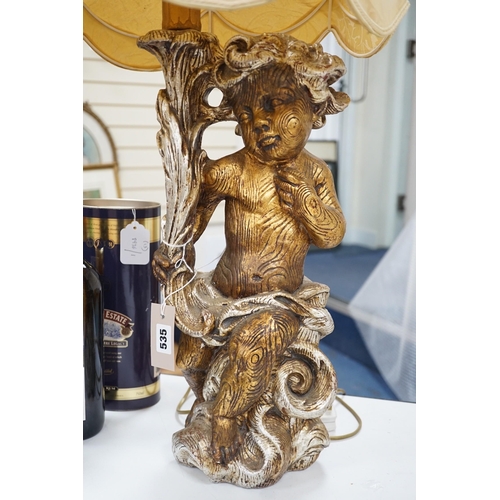 535 - A gilt composition putti table lamp. 86cm tall