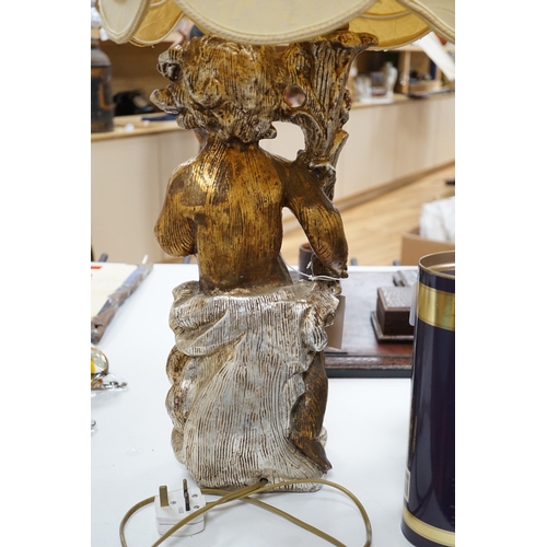 535 - A gilt composition putti table lamp. 86cm tall