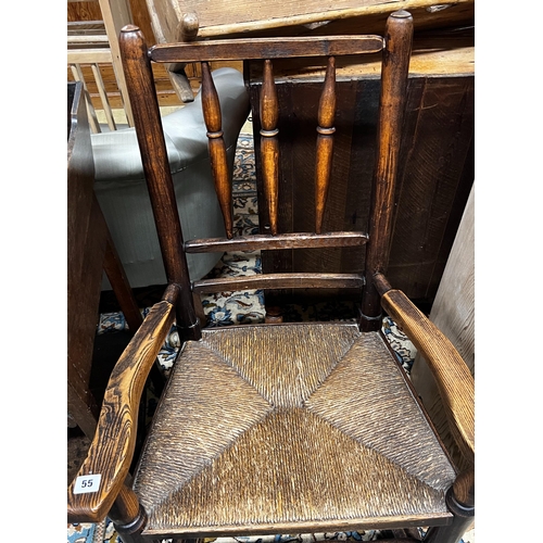 55 - An early 19th century ash rush seat spindle back rocking chair, width 60cm, depth 46cm, height 94cm... 