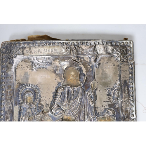 553 - A 19th century Eastern European icon with white metal oklad 30x26cm