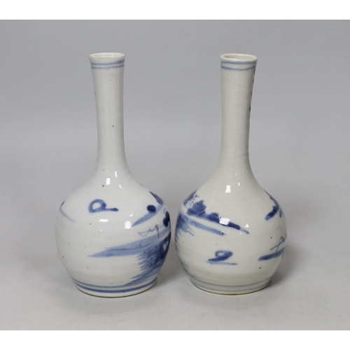 554 - A pair of 19th century Chinese blue and white bottle vases, 16cm