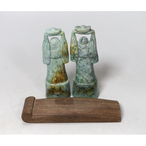 555 - A pair of jadeite figural carvings and a gouged wood pan rest