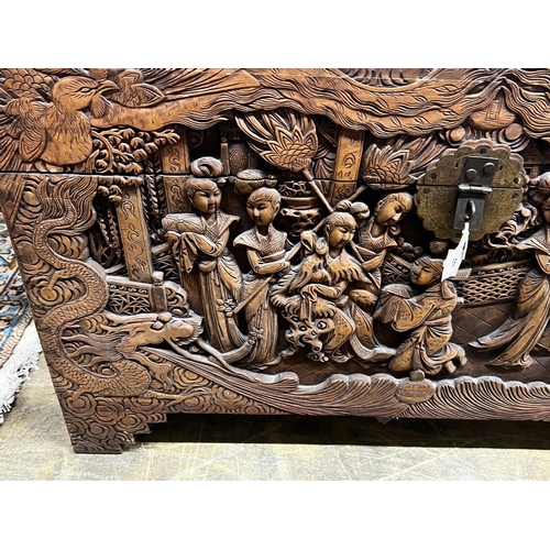 58 - A Chinese carved camphorwood trunk, length 104cm, depth 52cm, height 61cm