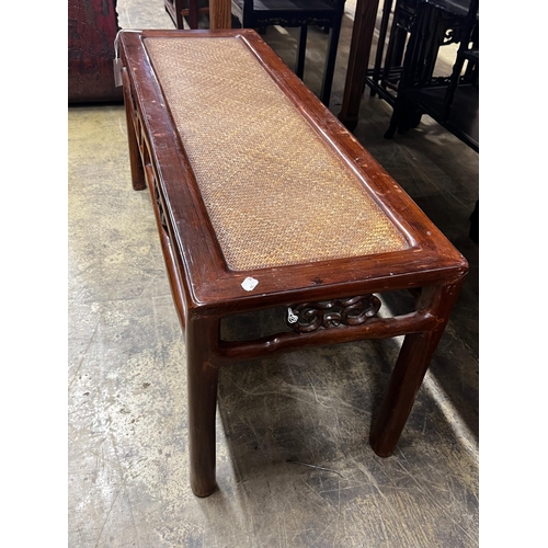 64 - A Chinese caned hardwood rectangular low table, length 110cm, depth 38cm, height 48cm