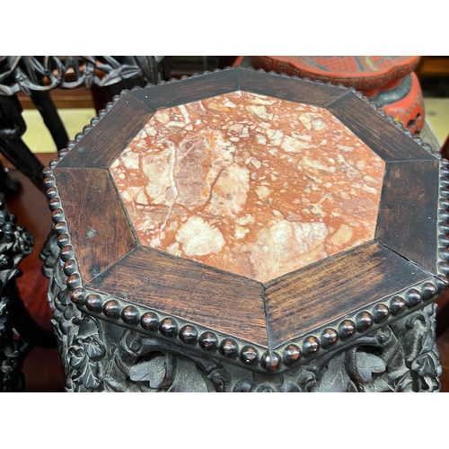 69 - A near pair of Chinese marble top octagonal carved hongmu vase stands, width 40cm, height 62cm... 