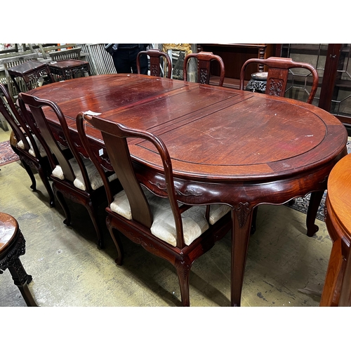 71 - A Chinese hardwood extending dining table, length 244cm extended, two spare leaves, width 110cm, hei... 