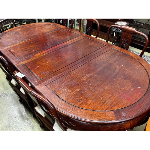 71 - A Chinese hardwood extending dining table, length 244cm extended, two spare leaves, width 110cm, hei... 