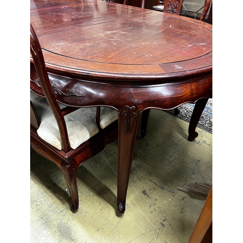 71 - A Chinese hardwood extending dining table, length 244cm extended, two spare leaves, width 110cm, hei... 