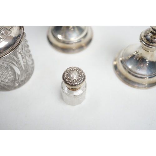 801 - A pair of 1930's silver mounted dwarf candlesticks, 10cm, a silver mounted glass hair tidy and a sce... 