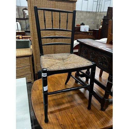 1075 - A 19th century ebonised beech rush seat Sussex style chair, width 41cm, height 83cm