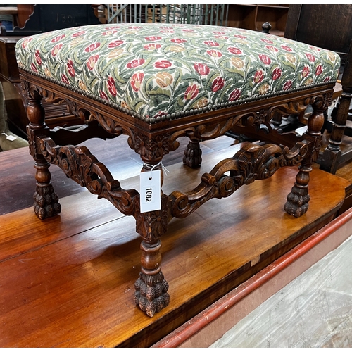 1082 - An early 20th century Jacobean revival carved beech dressing stool, length 60cm, depth 48cm, height ... 