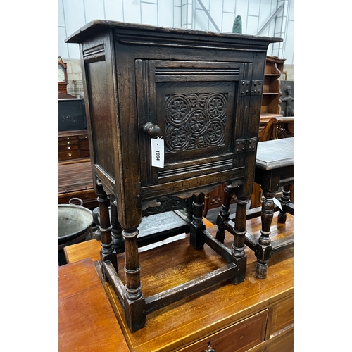 1084 - A small 17th century style carved oak side cabinet, width 53cm, depth 34cm, height 83cm