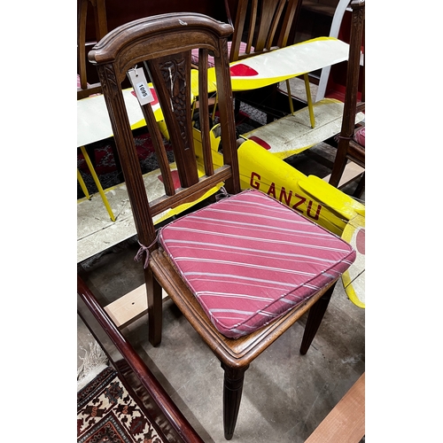 1095 - A set of four early 20th century French walnut dining chairs