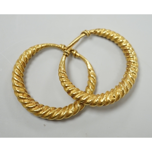 1964 - A pair of possibly Roman? yellow metal spiral twist loop earrings, 30mm, 8 grams.