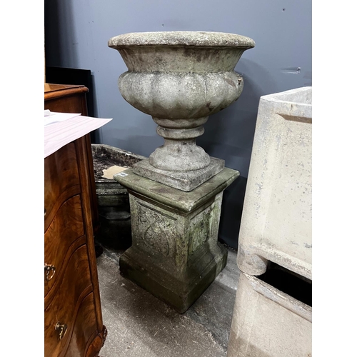 1001 - A circular reconstituted stone garden planter on square plinth, diameter 40cm, height 84cm together ... 