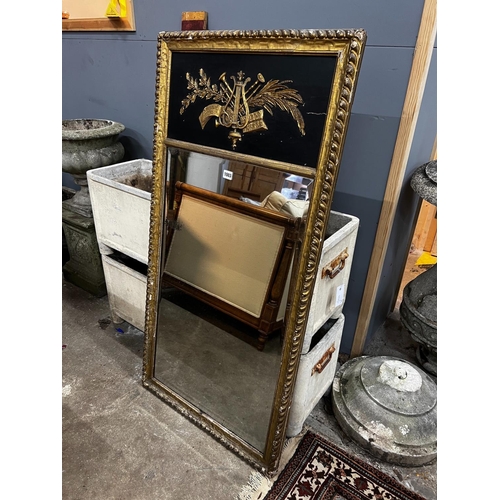 1003 - A Regency painted gilt and gesso pier glass with musical trophy tablet, width 62cm, height 124cm... 