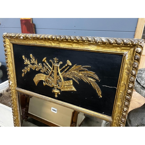 1003 - A Regency painted gilt and gesso pier glass with musical trophy tablet, width 62cm, height 124cm... 