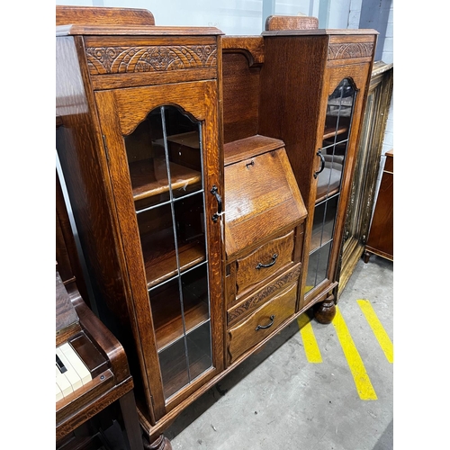 1007 - An early 20th century oak bureau bookcase, length 120cm, depth 28cm, height 154cm