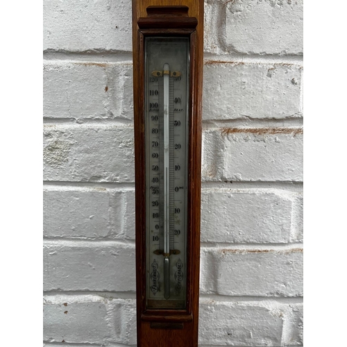 1015 - A Victorian oak stick barometer marked J H Steward, London, height 100cm