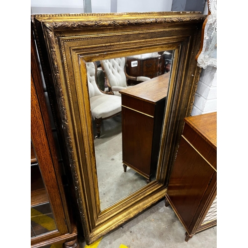 1016 - A Victorian rectangular giltwood and composition wall mirror (converted picture frame), 134cm x 80cm... 